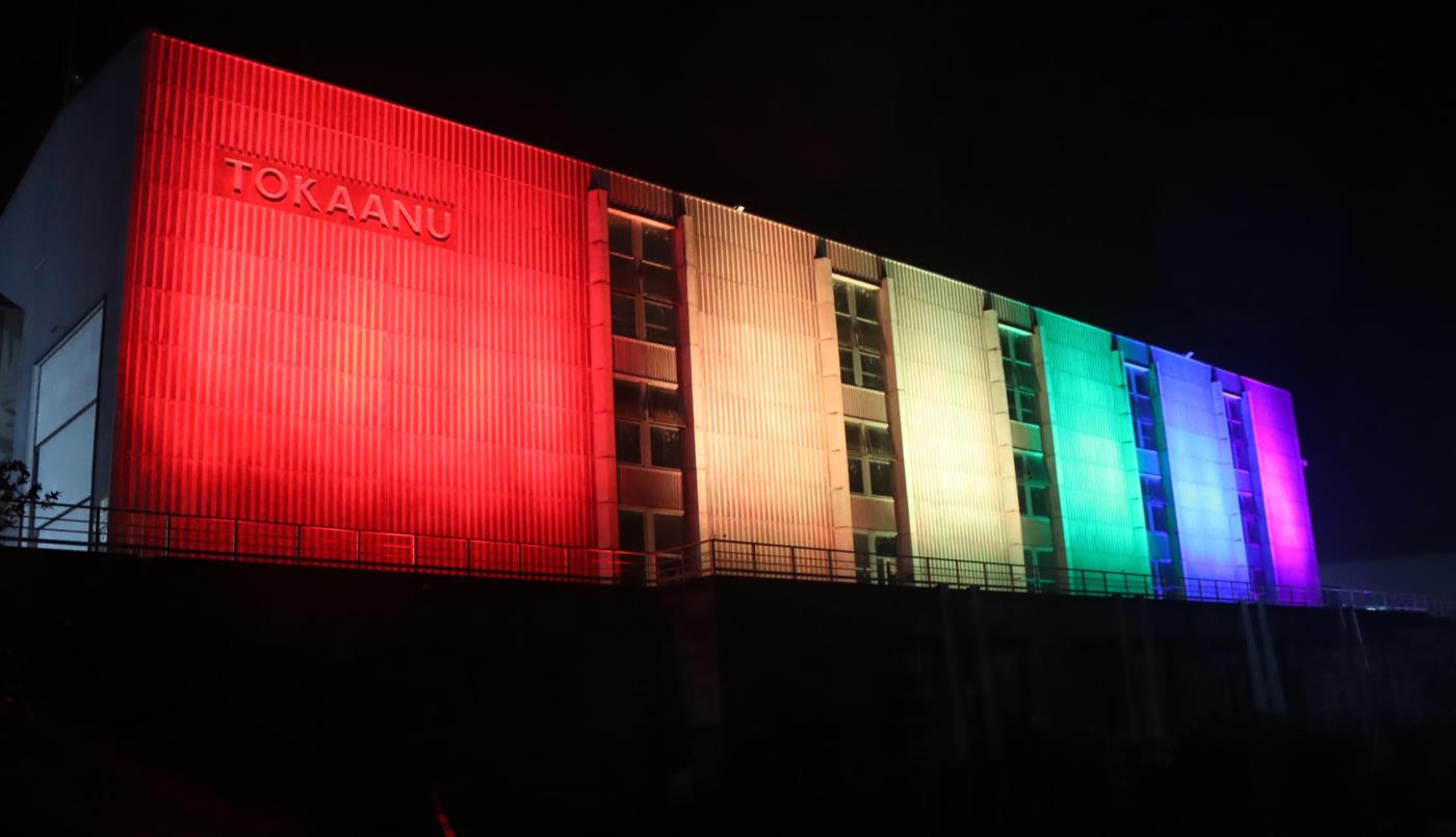 Tokaanu Power Station lit up in rainbow colours to celebrate the Rainbow Tick certification.