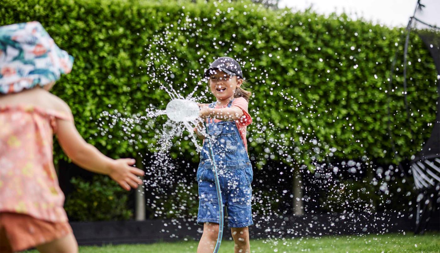 Children playing sprinkler 