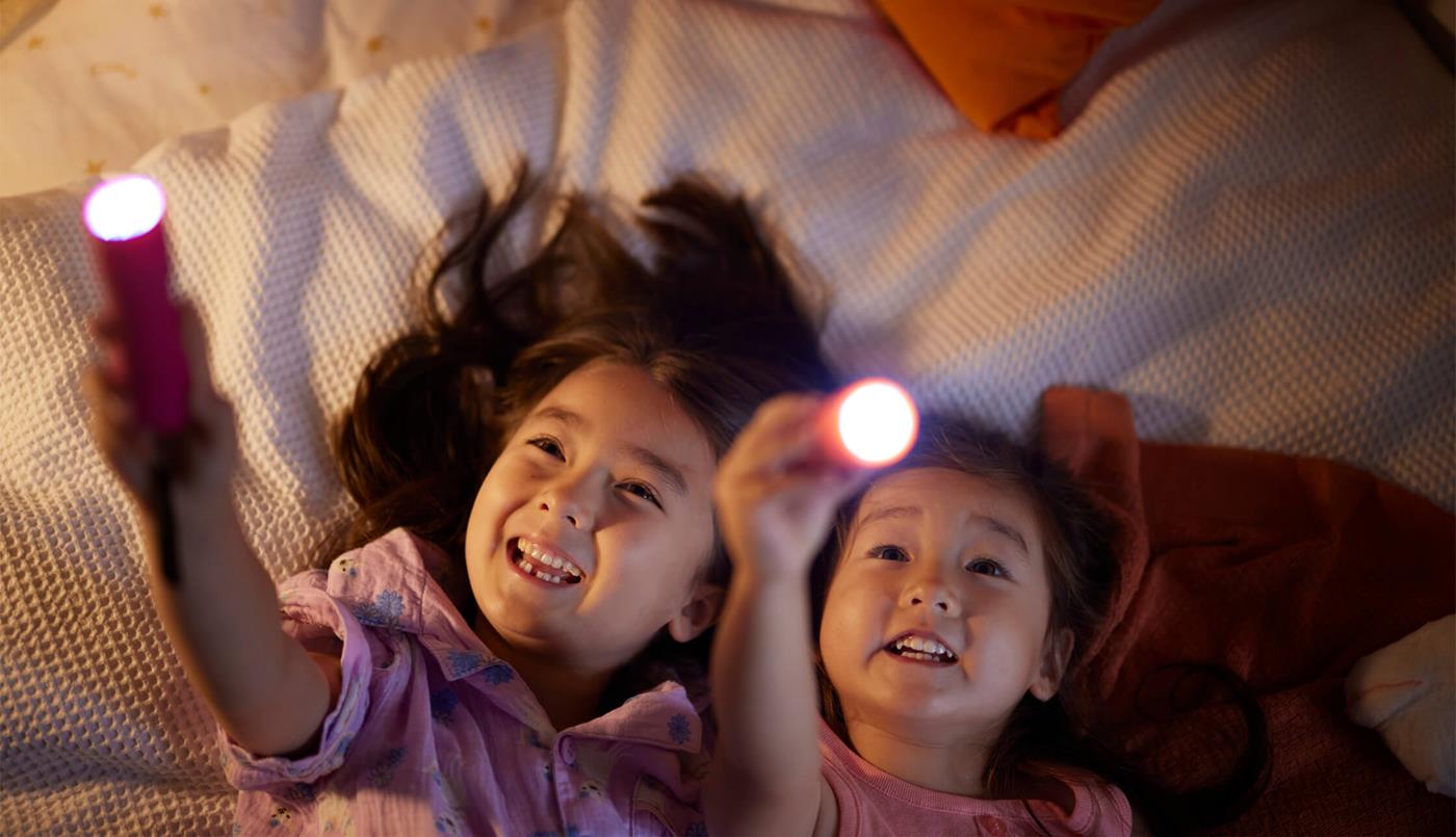 Children playing with lights