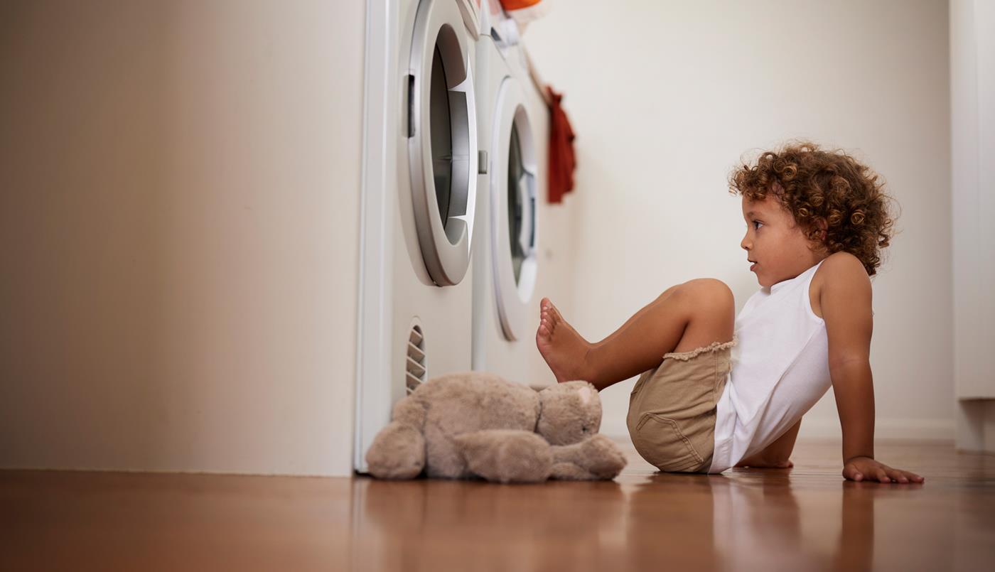 Kid in front of dryer