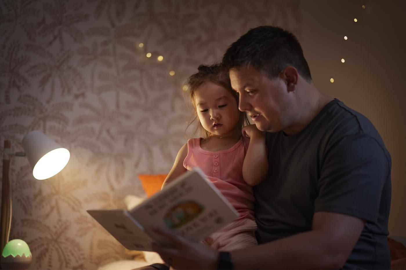 Dad reading to child at night