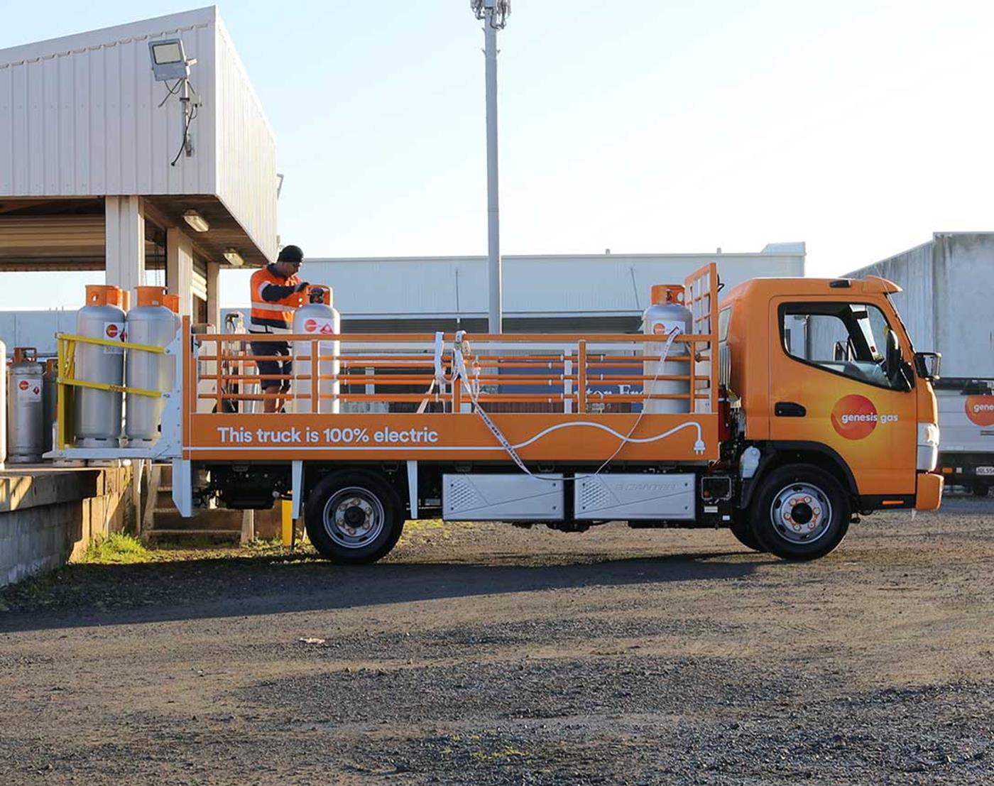 Genesis branded orange electric truck