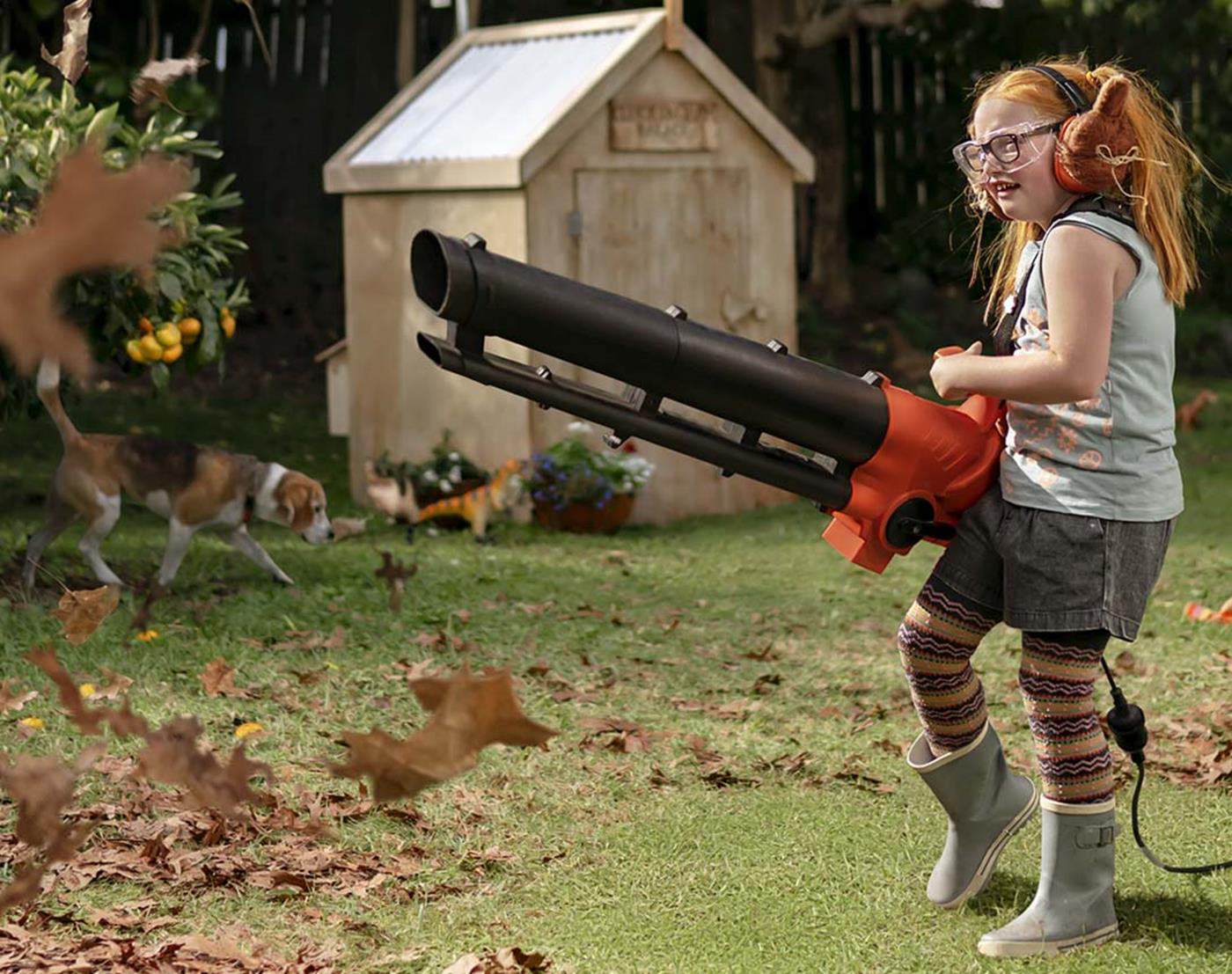 Girl with leaf blower
