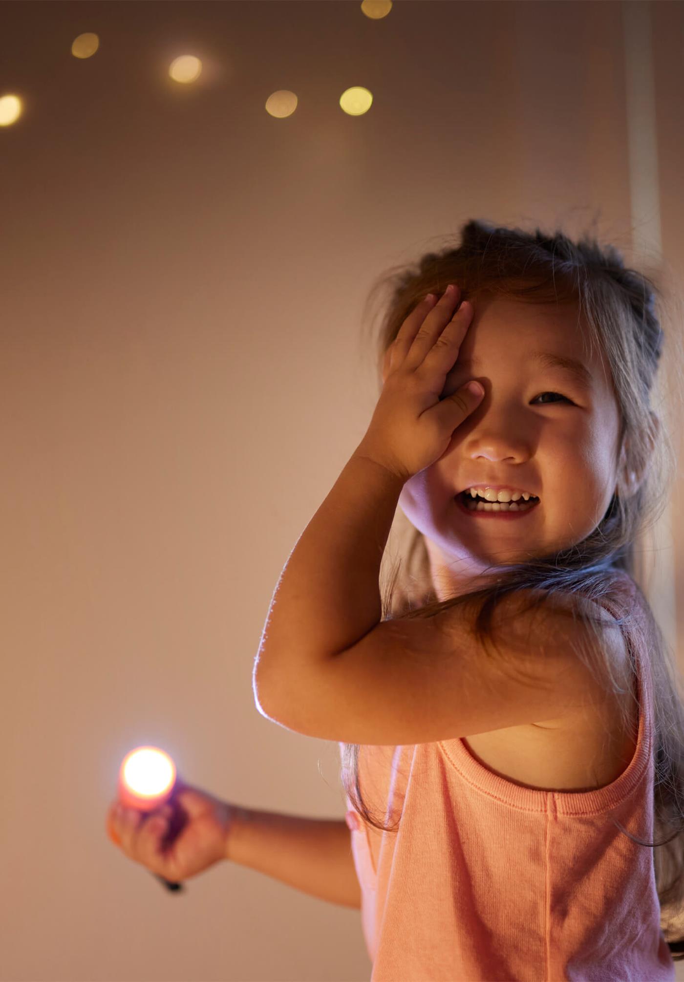 Child playing with light