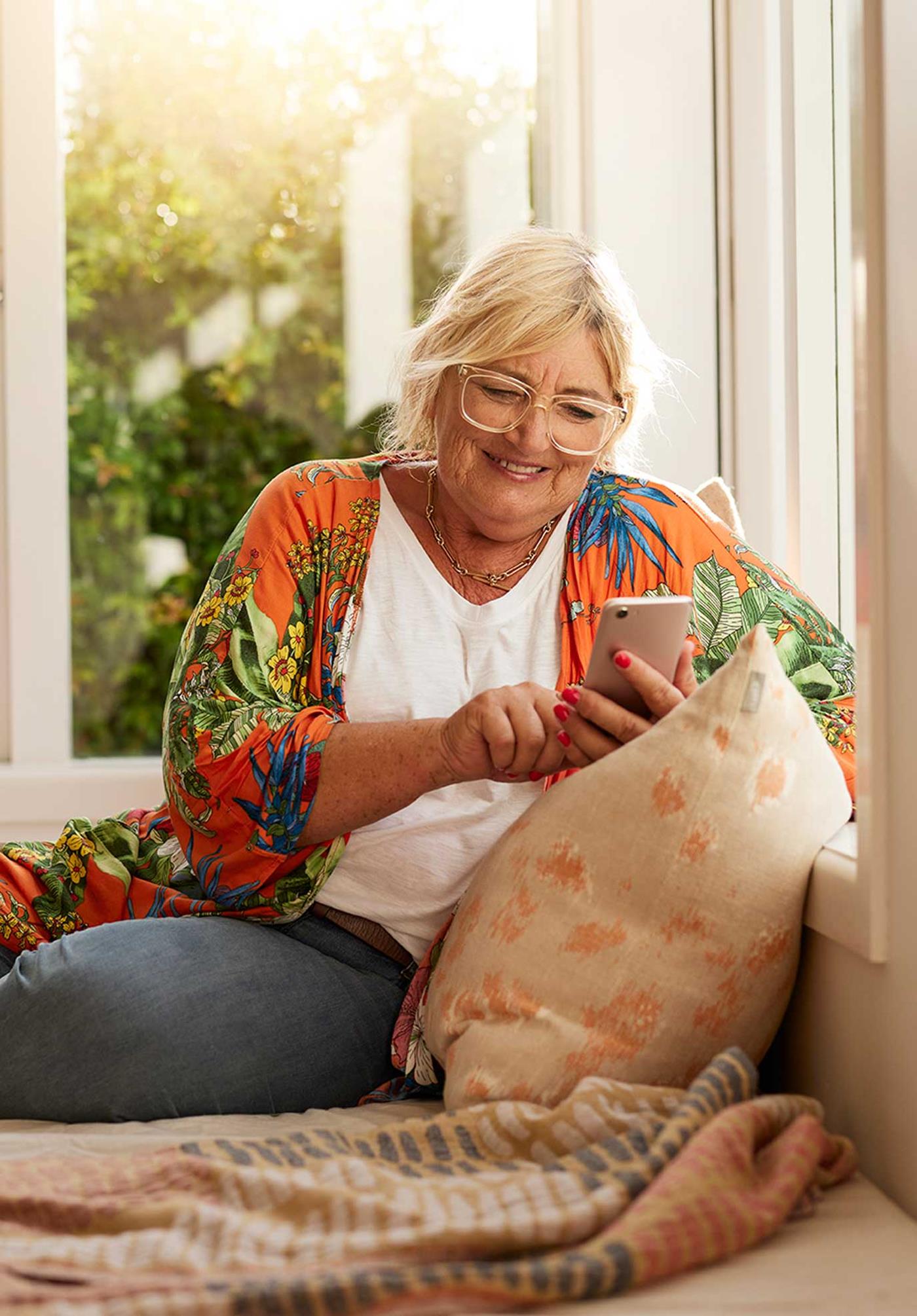 woman on couch with phone