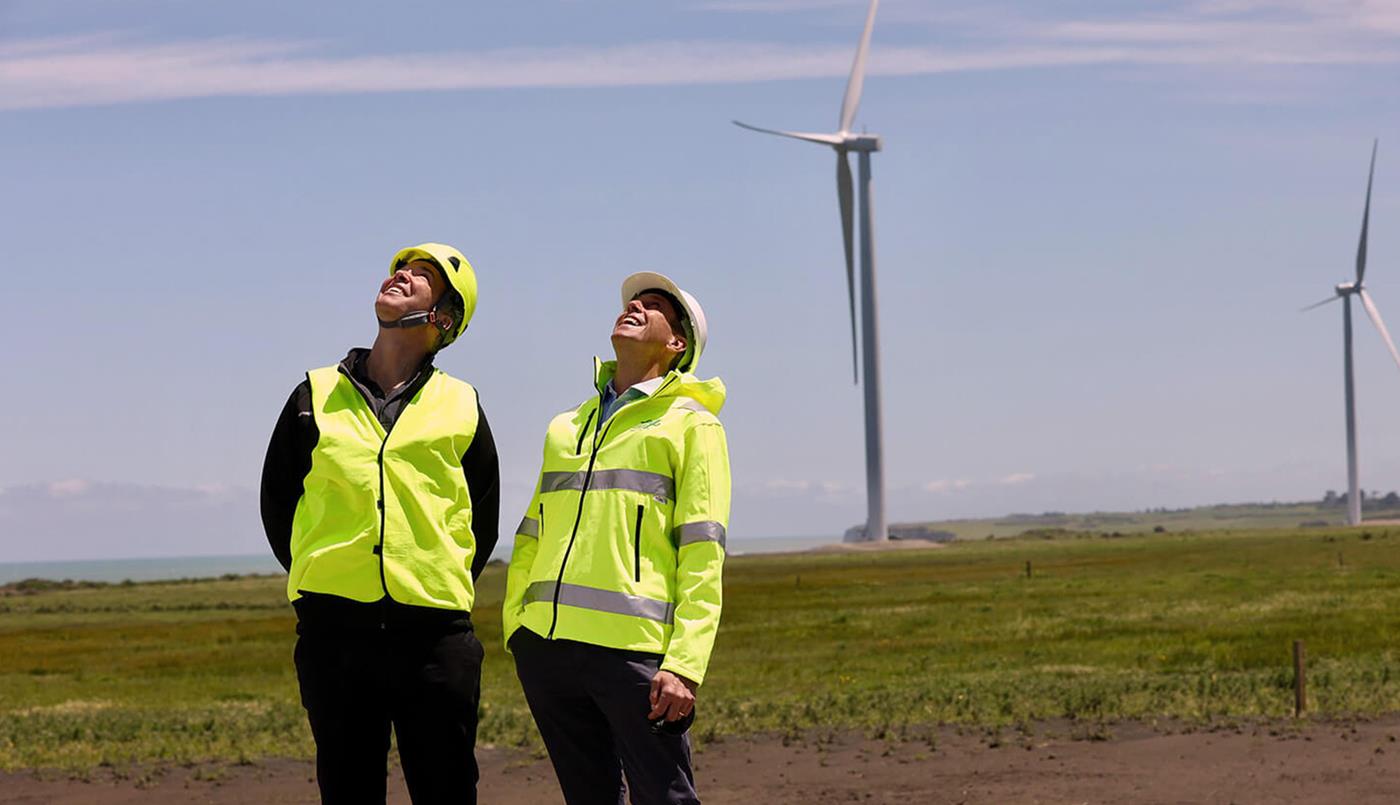 People in high vis on wind farm